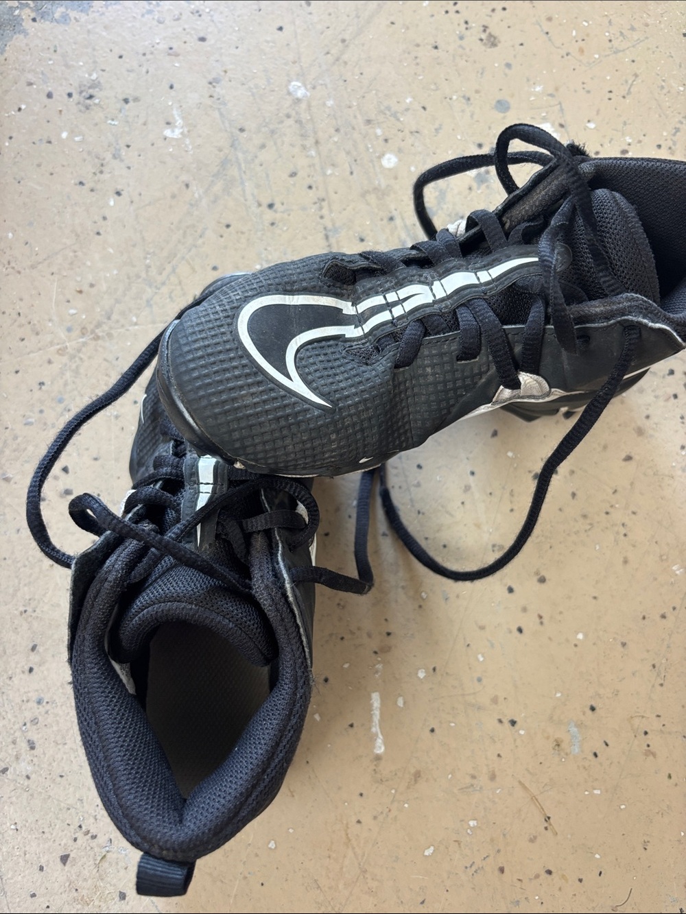 Nike Black Athletic Shoes with White Swoosh Detailing